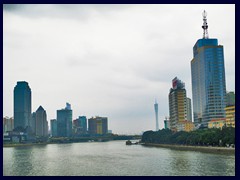 View of Yuexiu distric and Haizhu district in central Guangzhou from a bridge above Pearl River. In the background is Canton Tower.